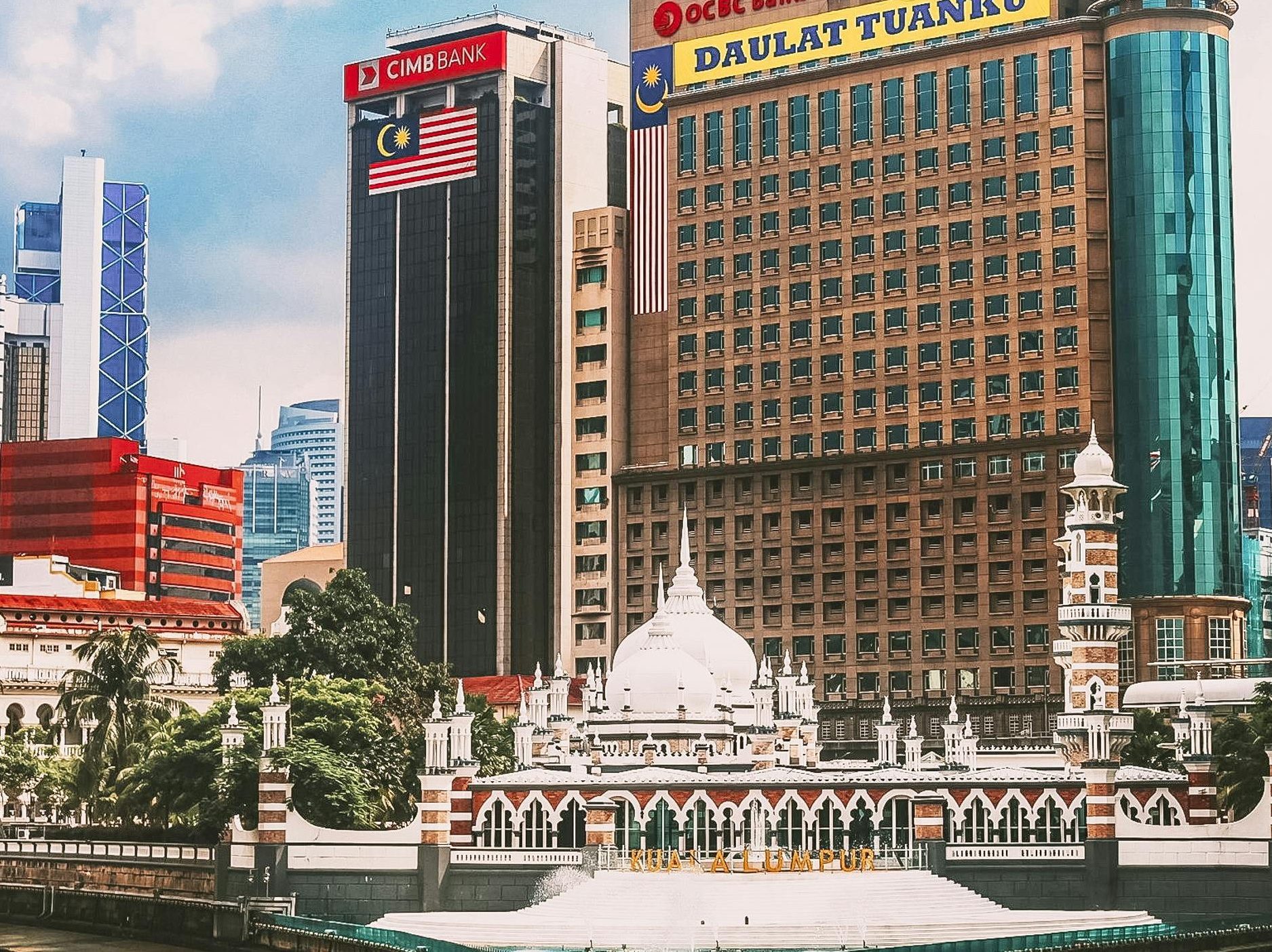 Scenic view of Kuala Lumpur's skyline featuring modern skyscrapers and iconic architecture.