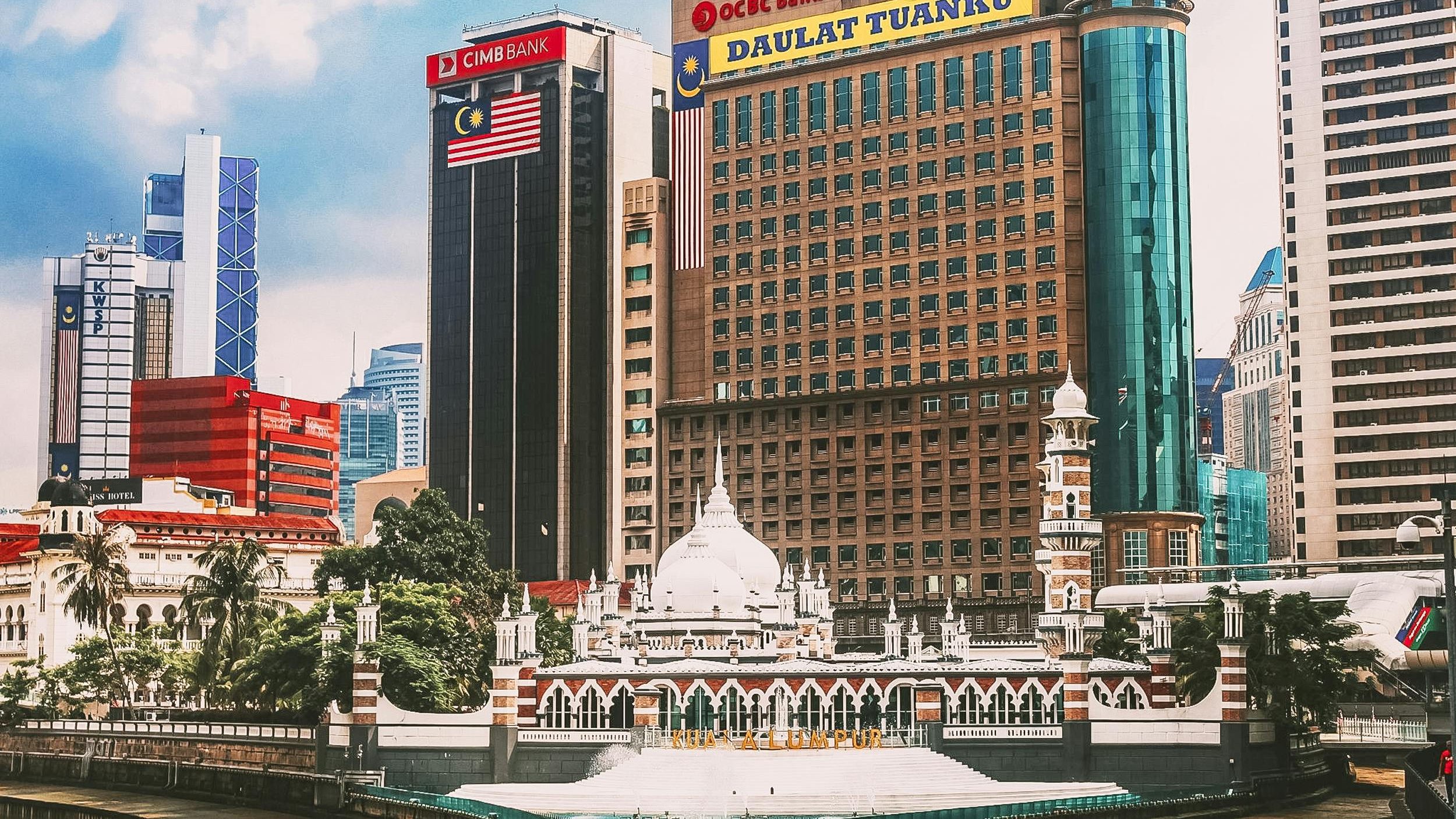 Scenic view of Kuala Lumpur's skyline featuring modern skyscrapers and iconic architecture.